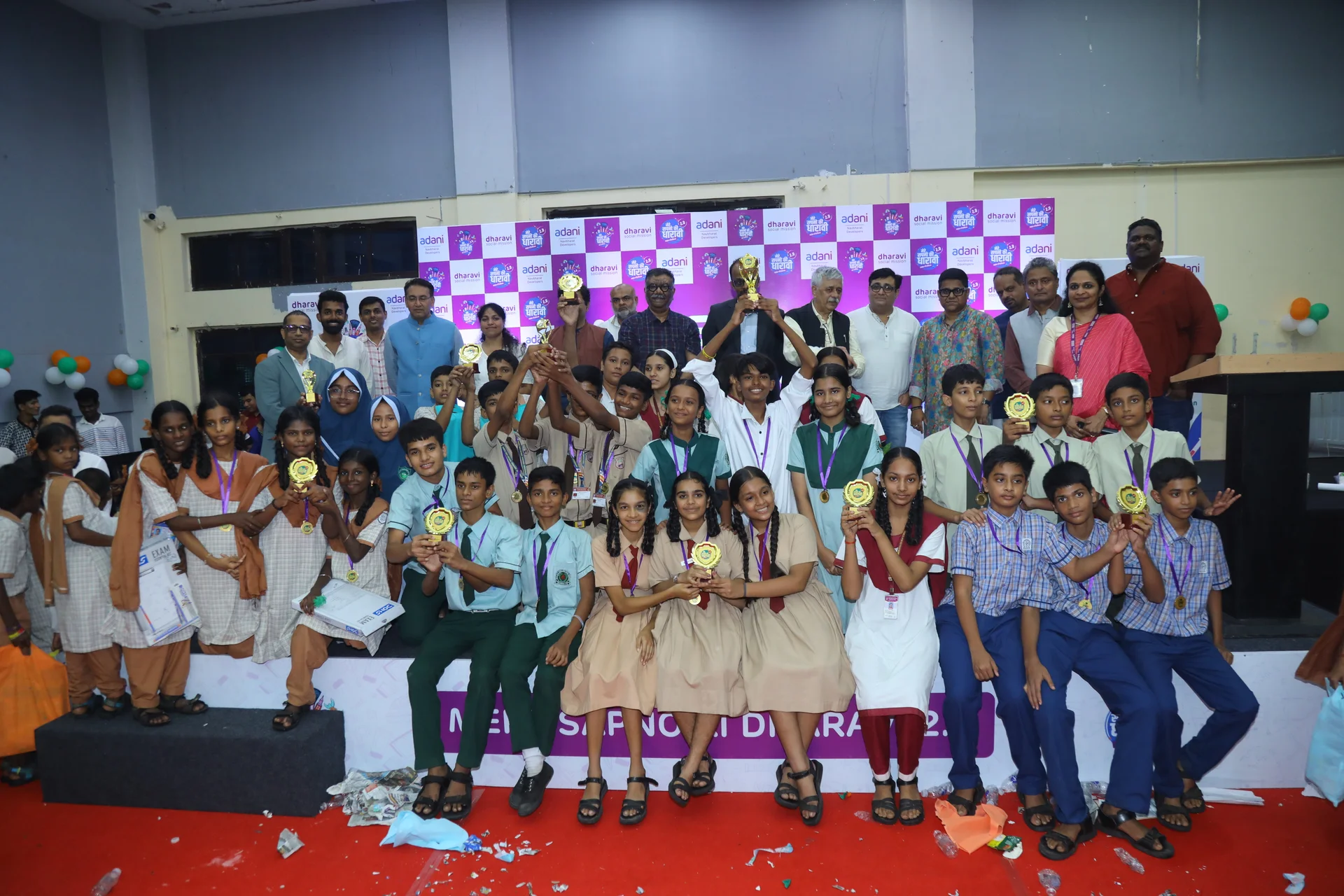 Mere Sapno Ki Dharavi 2.0 — Students celebrating with trophies